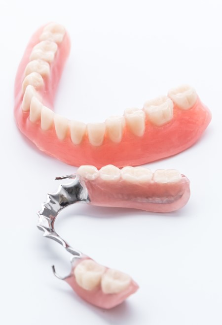 Set of dentures on white background